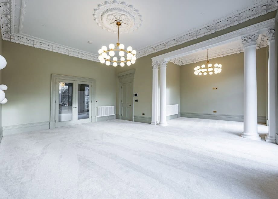 Grand reception room with restored cornices and columns
